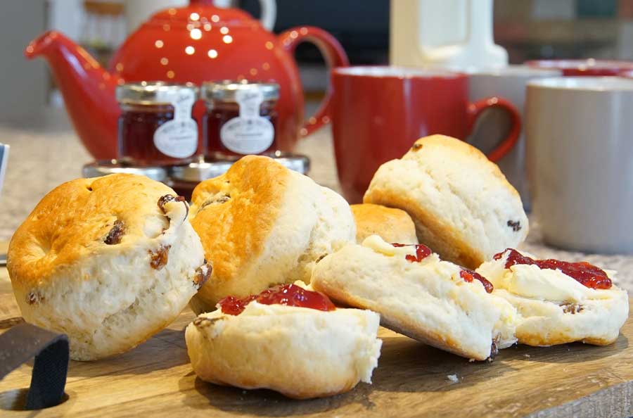 The kitchen of the Anchorage holiay cottage in Putsborough with some yummy scones and jam