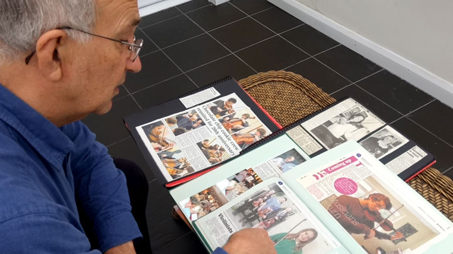 Keith talks us through some of his recent students high grades in his scrapbook