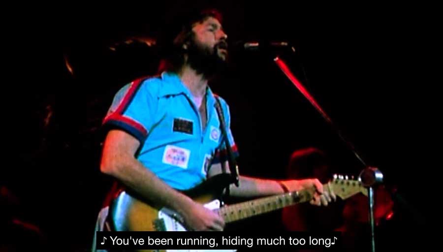 Eric Clapton on stage singing Layla