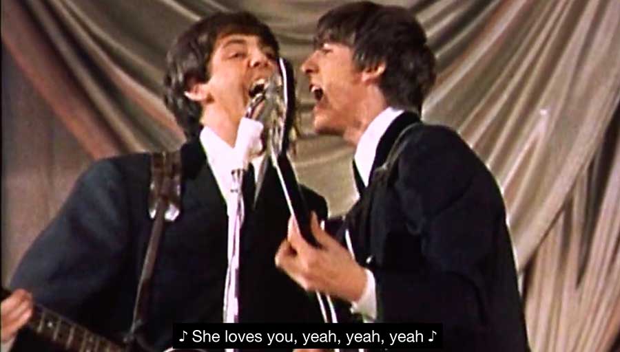 The beatles performing She Loves You on Tony Palmers historic documentary All You Need Is Love