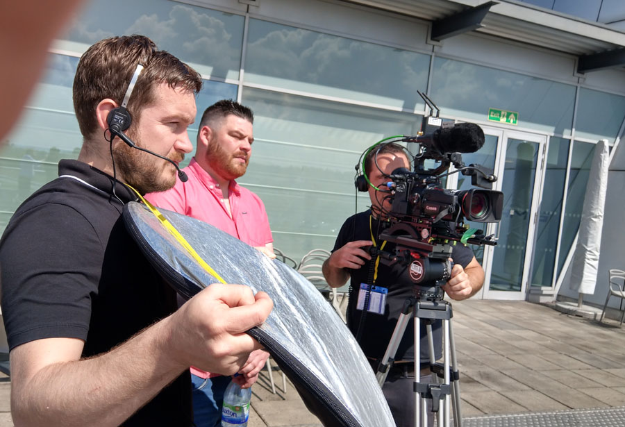 Ben and Pete make use of the sunshine to Interview racers looking over the track