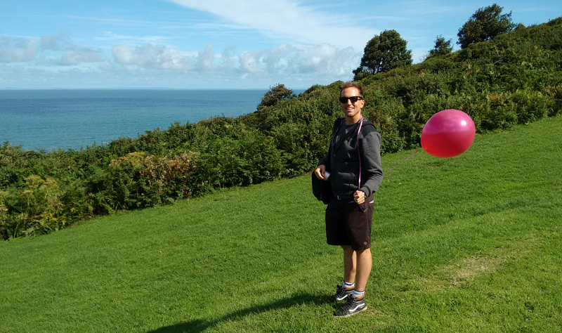 Simon having fun with the balloon prop on set